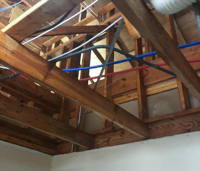 Wood beams in attic post restoration.