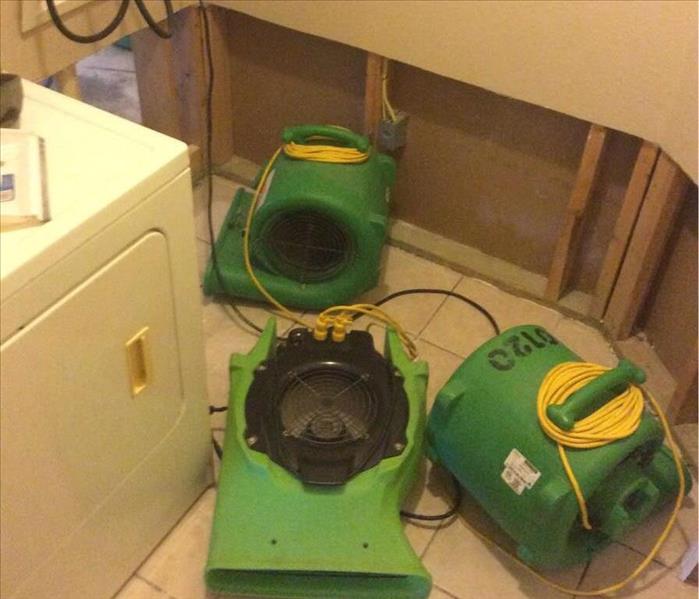 Drying equipment and flood cuts after a water loss in a home.
