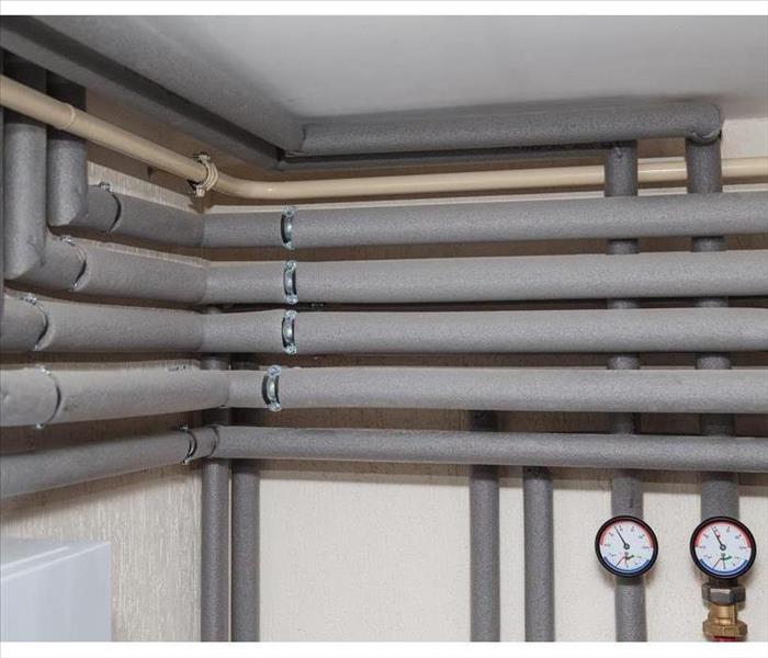Plumbing system covered with insulation covers.